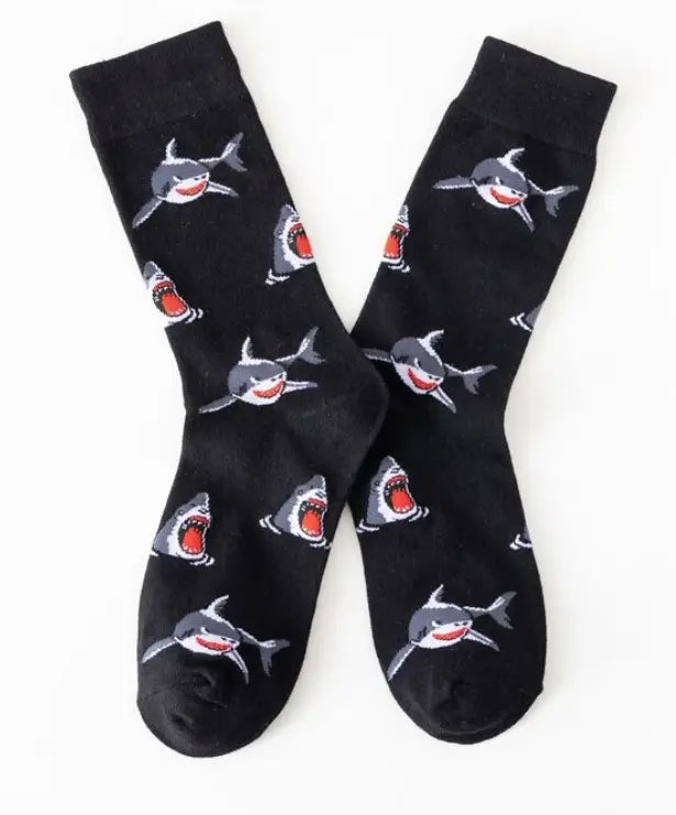 close up of a pair of socks with sharks on them